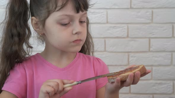 Spread jam on the bread. 