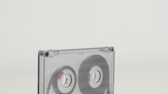 Retro transparent analog magnetic tape 4K 2160p 30fps UltraHD tilting footage - Details of compact  
