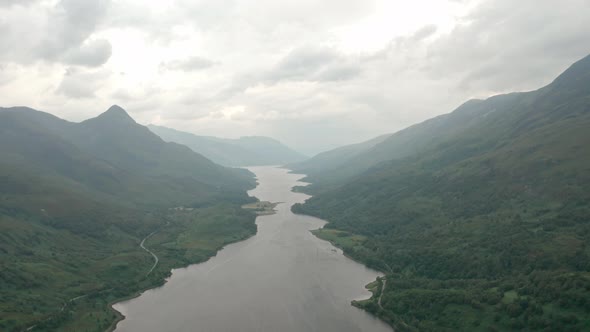 High descending drone shot over Scottish Loch