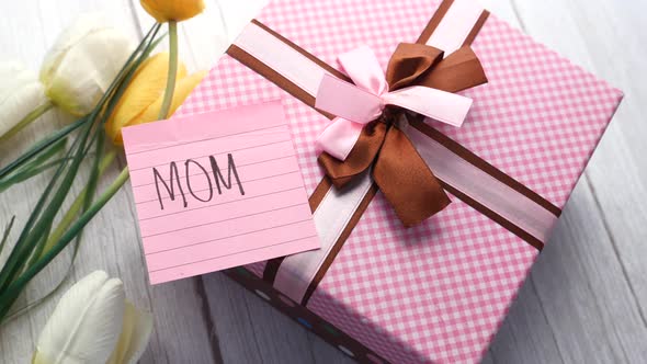 Mother Day Gift and Tulip Flower on White Background, Close Up.