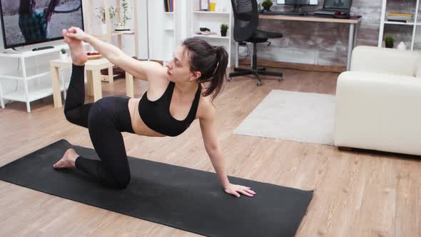 Young Woman Doing a Home Workout for a Good Posture