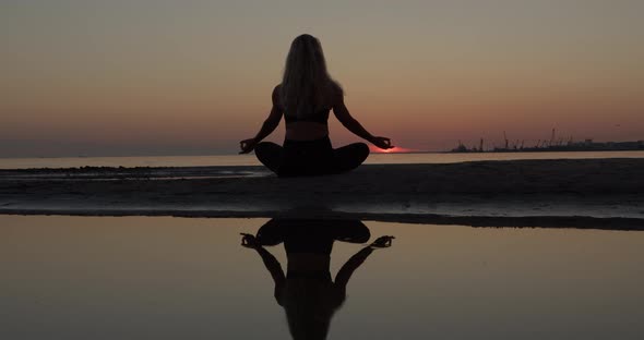 Yoga Woman Meditate on Beach at Sunset Balancing Mental Healt