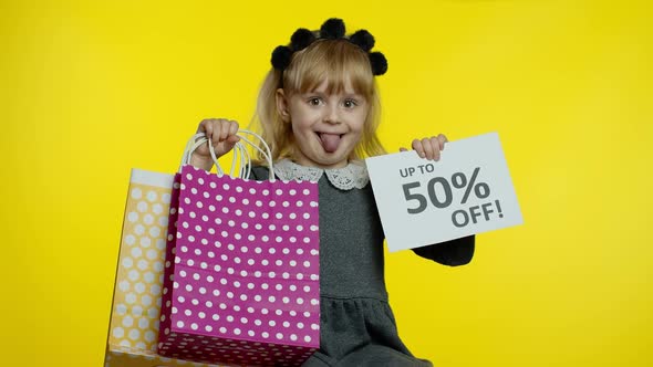 Child Girl Showing Up To 50 Percent Off Inscription Sign and Shopping Bags. Teen Pupil Smiling