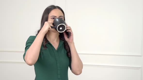 Indian woman talking on call in morning