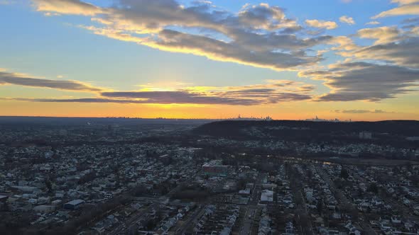 Orange Dramatic Sky with Clouds for Beautiful Sunrise in a Above Aerial View New York City of a