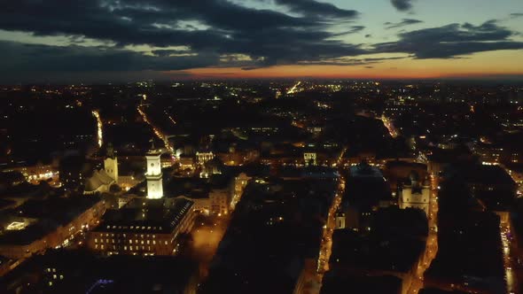 Flight Above the Roofs on Sunrise. Old European City. Ukraine Lviv City