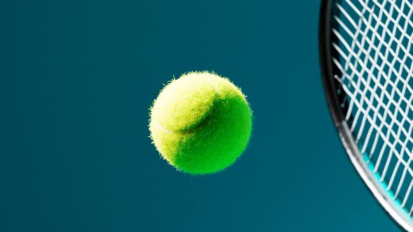 Slow-motion animation of the tennis racket striking the ball. A ball hit. 4 K HD