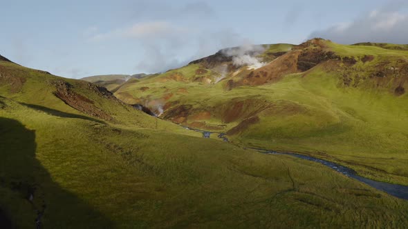 Geothermal power shown in the steam coming out of the icelandic hills