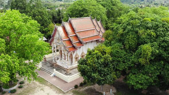 Classic Buddhist Temple Between Forest, From Above Drone View Buddhist Monastery Between Green Trees