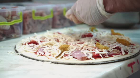 Chefs making pizza in commercial kitchen. Pizza Place. Food Preparation. Pizza Chef.
