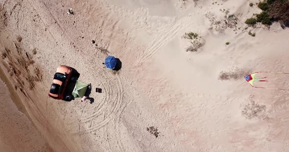 Top Down View of Solo Camping on Tropical Sandy Beach