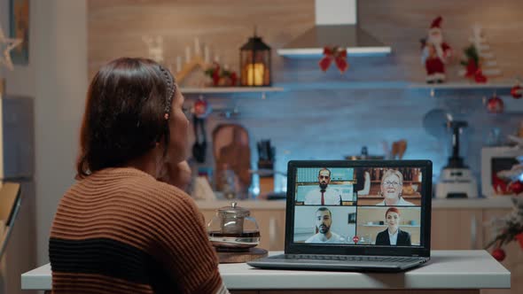 Woman on Video Call with Workmates at Home