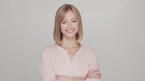 Studio portrait of young, beautiful and natural blond woman.