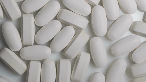 Pills Rotate on White Background. Medicine, Sport Supplement, Creatine, Hmb, Bcaa, Amino Acid or