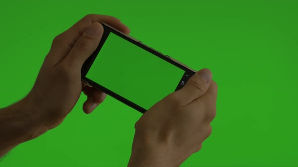 Smart phone green screen  background 4K UHD 2160p footage - Mobile  phone using green screen backgro