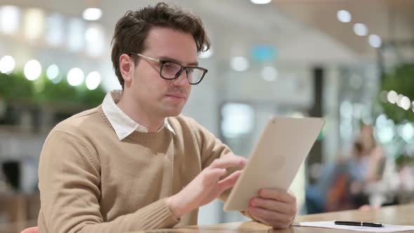 Failure for Man on Tablet in Office