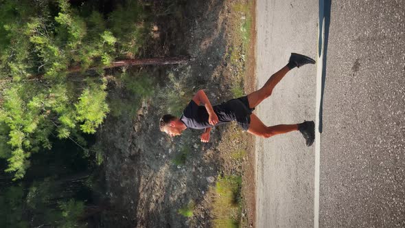 Mun Sportsman running outdoors. Vertical