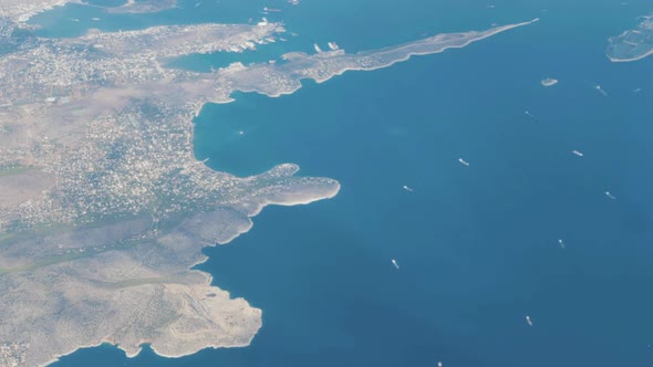 Stunning aerial shot of Athens and ships travelling to port
