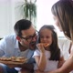 Happy Family Sharing Pizza Together at Home - VideoHive Item for Sale