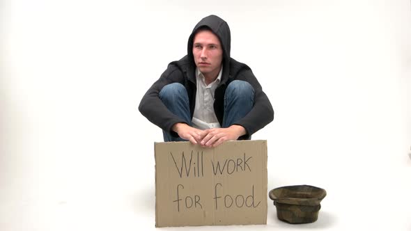 Sad Young Man Holding Poster Will Work for Wood