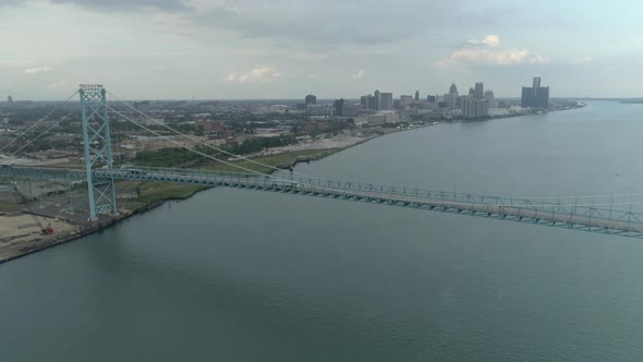 This video is about an aerial of the Ambassador Bridge over the Detroit river near downtown Detroit.