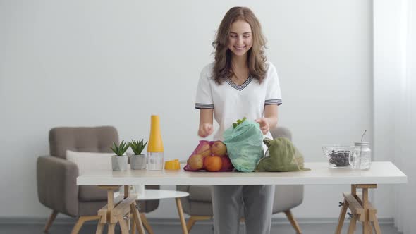 Young Cute Girl Preparing To Cooking a Salad