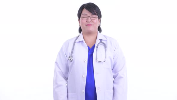 Happy Overweight Asian Woman Doctor Smiling