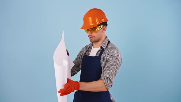 Male in Hard Hat Protective Goggles and Gloves