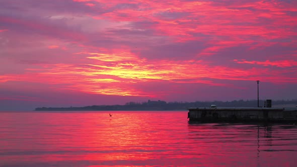 The beautiful red colors of sunset over the waves of Bulgaria - wide