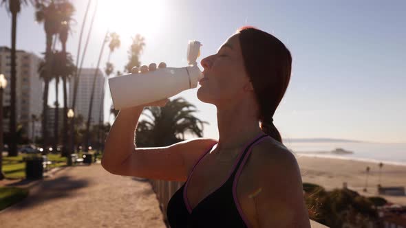 Mature Woman Exercising At The  Beach