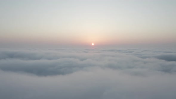 View of the fluffy clouds from above at a beautiful sunrise