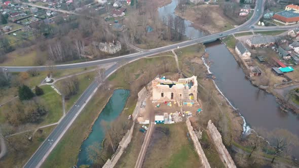 Medieval Castle the Town of Dobele on the West Bank of the River Berze in Winter. Aerial 