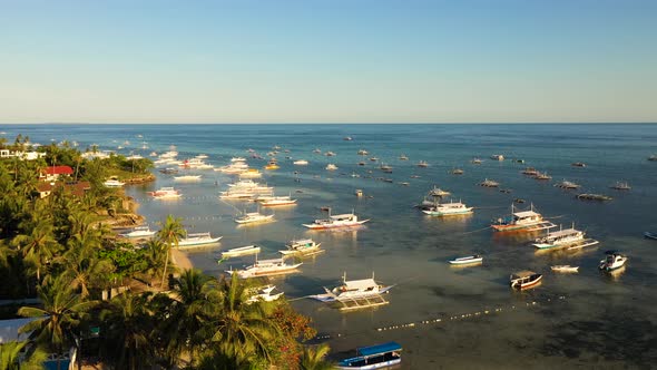 Boats on Alona Beach at Sunset. Panglao, Philippines.