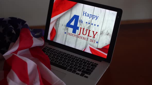 Laptop with Inscription Happy Independence Day on Usa Flag