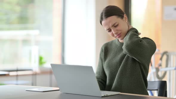 Young Woman with Laptop Having Neck Pain 