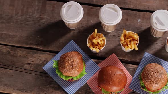 Hamburgers with Fries on Table.