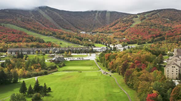 Cinematic  Aerial White Killington Ski Resort Area with Hotels and Golf Course