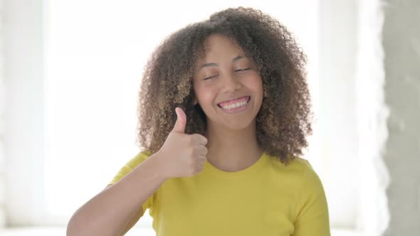 African Woman showing Thumbs Up Sign