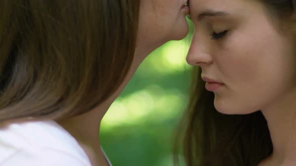 Caring Lesbian Kissing Her Partner on Forehead, Hugging and Supporting, Love