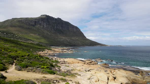 Aerial view of clear Atlantic ocean Llandudno coastline, Cape Town, South Africa.