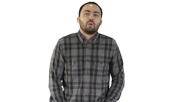 Young man walking and whistling on white background.