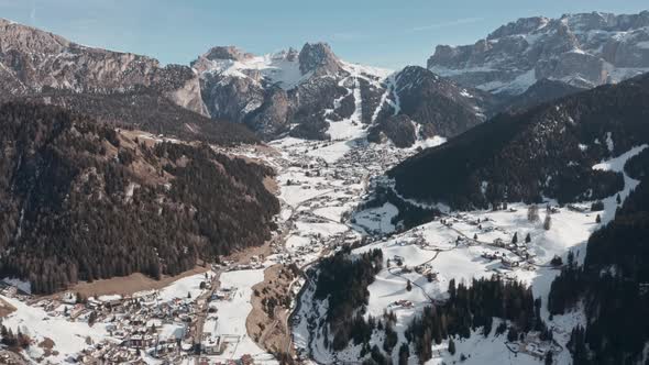 Dolly forward drone shot over Selva Wolkenstein valley dolomites