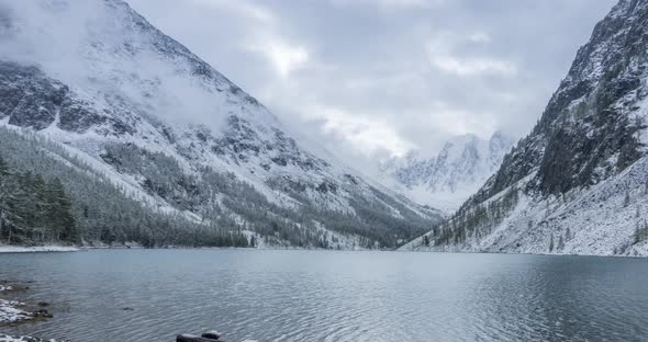 Snow Mountain Lake Timelapse at the Autumn Time. Wild Nature and Rural Mount Valley. Green Forest of