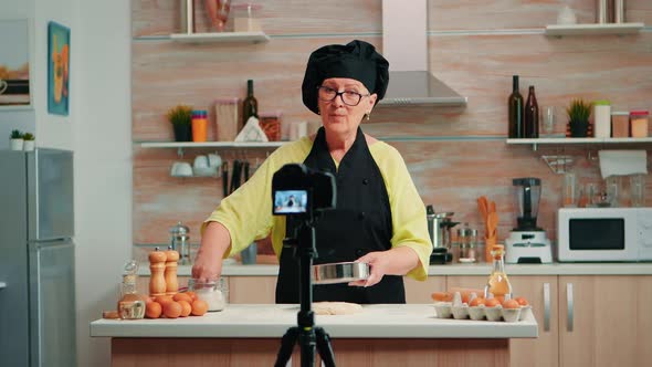 Elderly Woman Filming Cooking Vlog