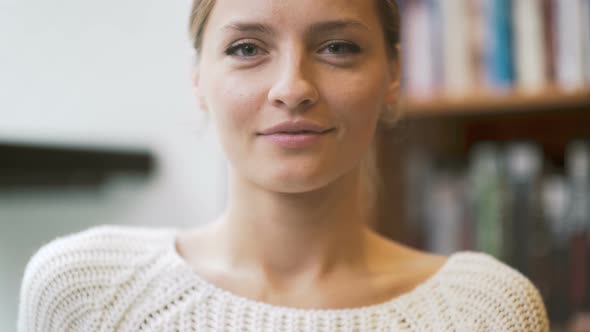 Close Up Of Woman's Face Smiling And Looking To Camera