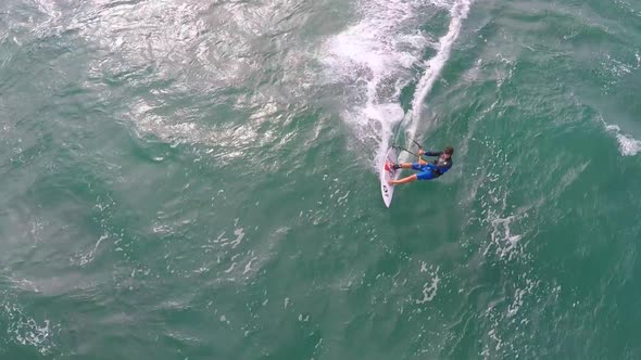 Aerial view of a man kitesurfing in Hawaii