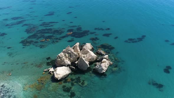 Lonely Rock in the Sea High Cliff of a Rocky Mountain Waves in a Blue Ocean Concept Calm Sea