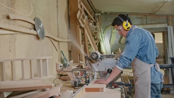 Young Woodworker Operating Bandsaw