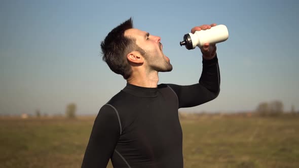 Athlete Cooling Down After Jogging Training On Trail.Tired Triathlete Jogger Relaxing After Workout.