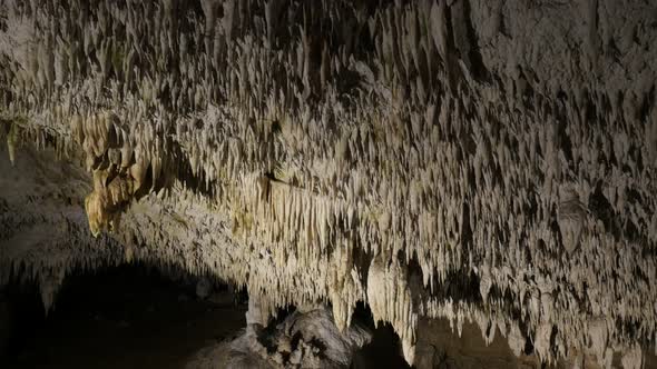 Stalactites   inside cave slow tilt  3840X2160 UltraHD  footage - Natural underground space wall and